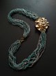 COLLANA MAREA Prezzo 700€ - Preziosa collana composta da importante istanziale in bronzo oro e perlenaturali, torchon agata azzurra.