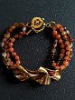 ORANGE AGATE BRACELET Price 150 € - Modern bracelet in gold bronze and natural pearl, orange agate torchon.