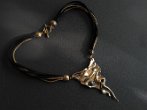 AKEIOS NECKLACE Price 200€ - Original necklace with triangle element in bronze silver and gold color, natural pearl and alcantara torchon.